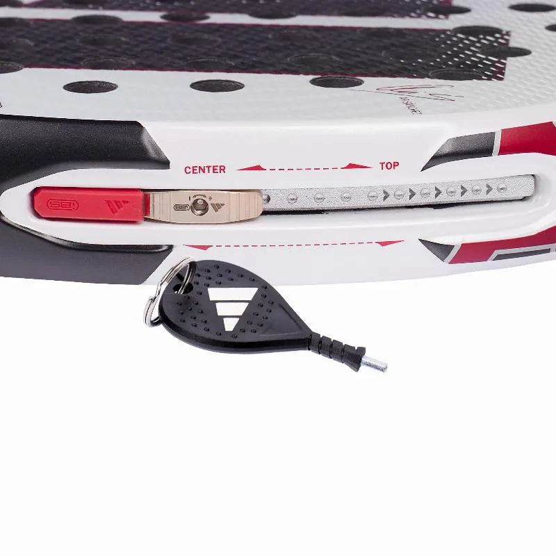 Adidas Arrow Hit Pro EDT padel racket in special edition with black and white design, featuring the brand logo and streamlined shape.