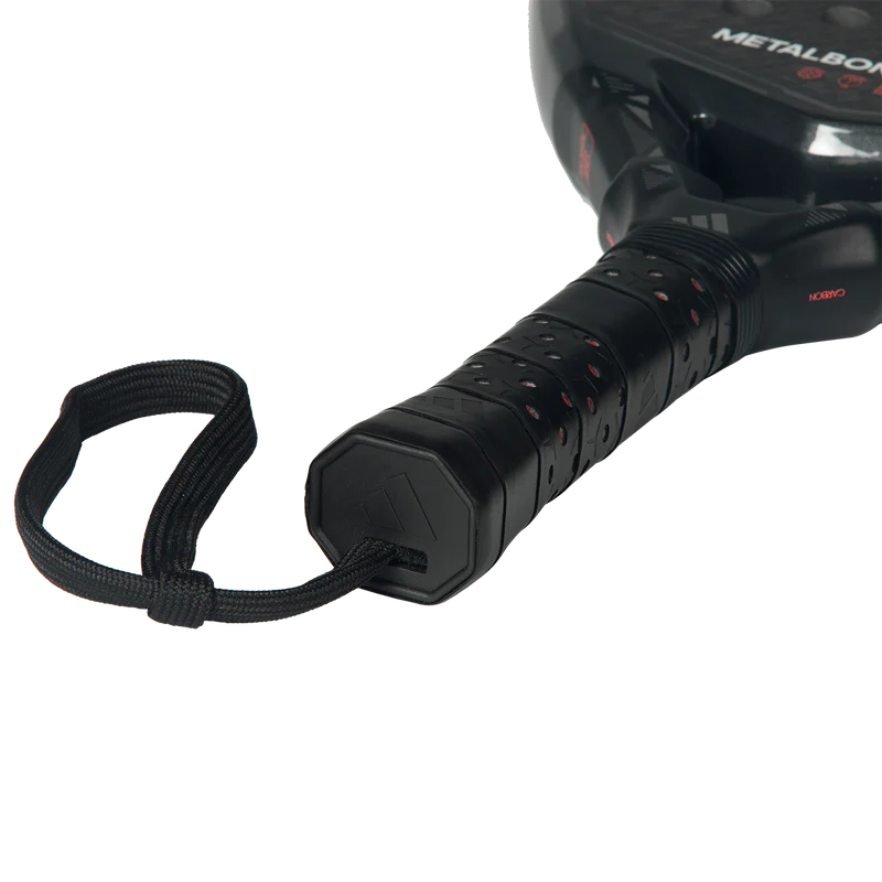 Adidas Metalbone Carbon 2026 padel racket with a sleek black and red design, featuring carbon fiber construction and ergonomic grip.