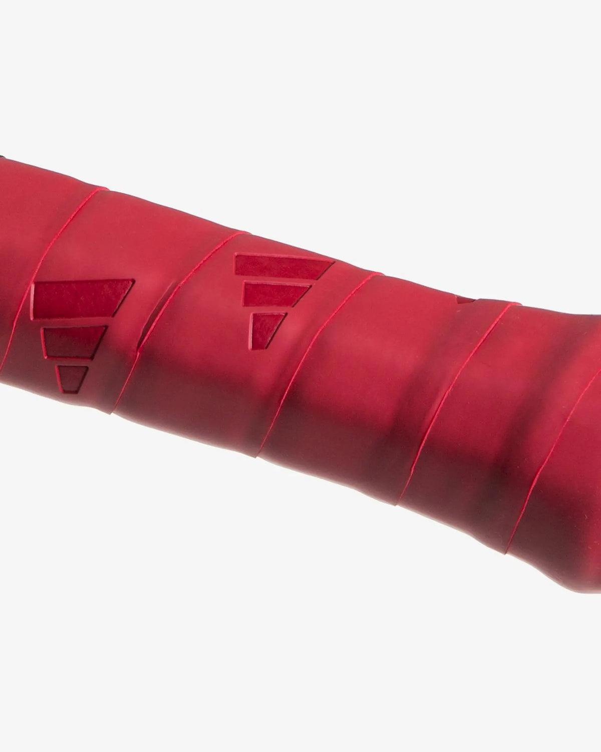 Red Adidas Padel replacement grip with textured surface, designed for secure hold and optimal performance during gameplay.