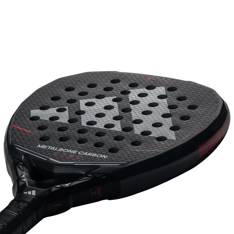Adidas Metalbone Carbon 2026 padel racket with black and silver design, featuring a lightweight carbon frame and ergonomic grip.