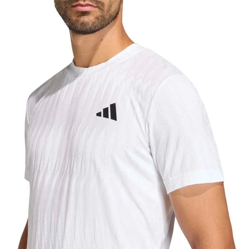 White Adidas Tennis Freelift T-Shirt displayed on a mannequin, featuring a comfortable fit and athletic design for tennis players.