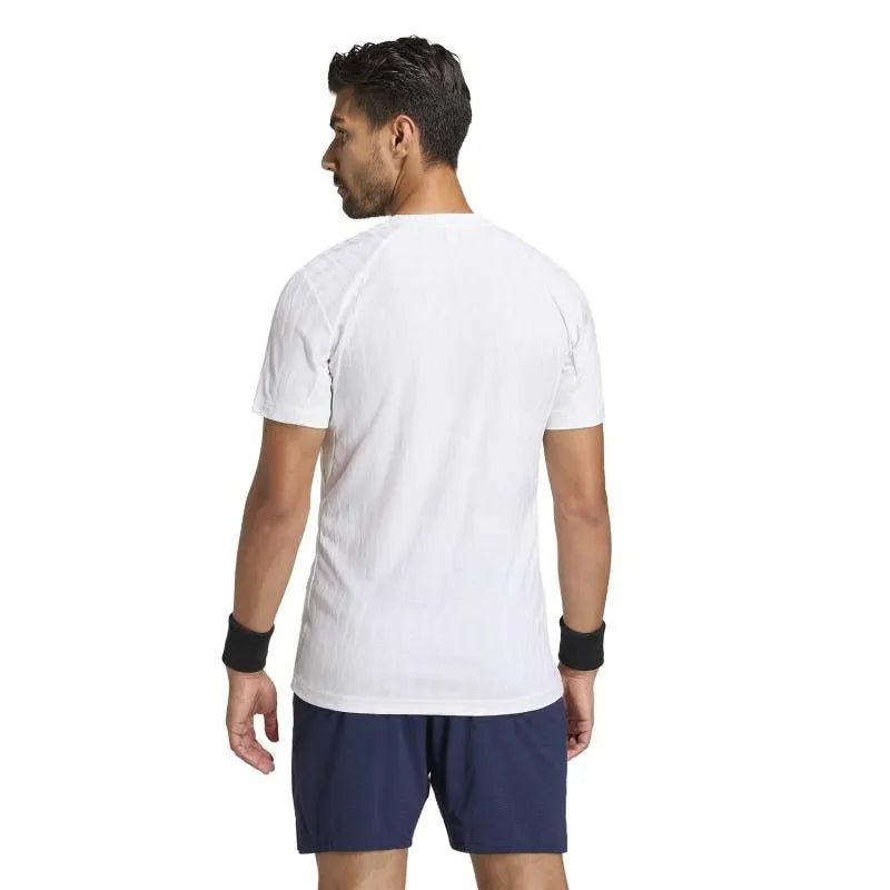 White Adidas Tennis Freelift T-Shirt for small size, featuring breathable fabric and athletic fit, ideal for tennis players.
