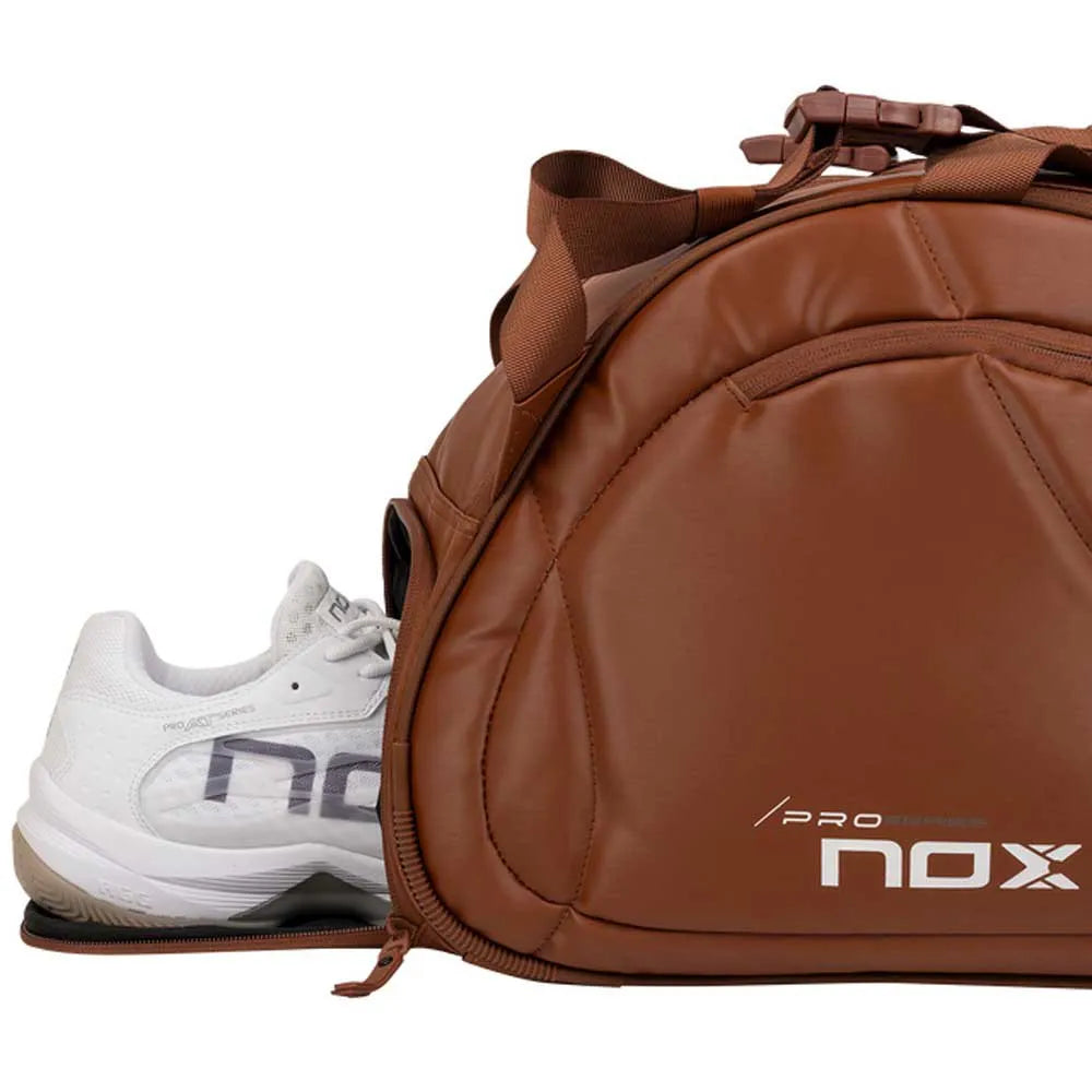 Large NOX Pro Series racket bag in brown camel with multiple compartments and padded straps, designed for tennis or paddle sports.