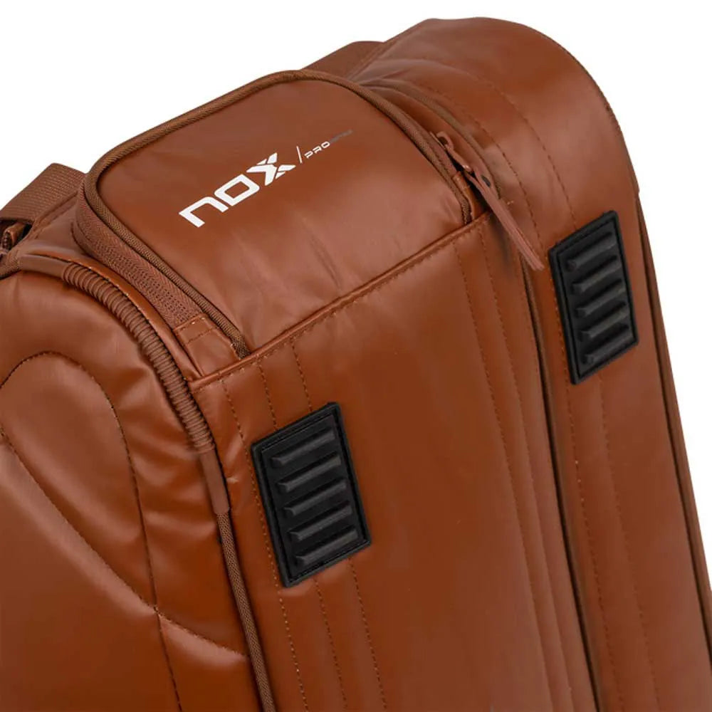 Large NOX Pro Series racket bag in brown camel color with multiple compartments, designed for tennis or squash gear.
