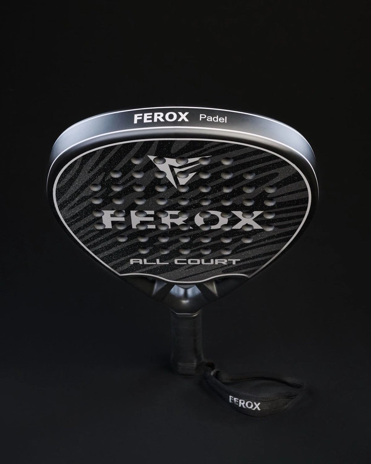 Ferox All Court 3K Padel Racket with black and red design, featuring a lightweight frame and textured surface for optimal control.