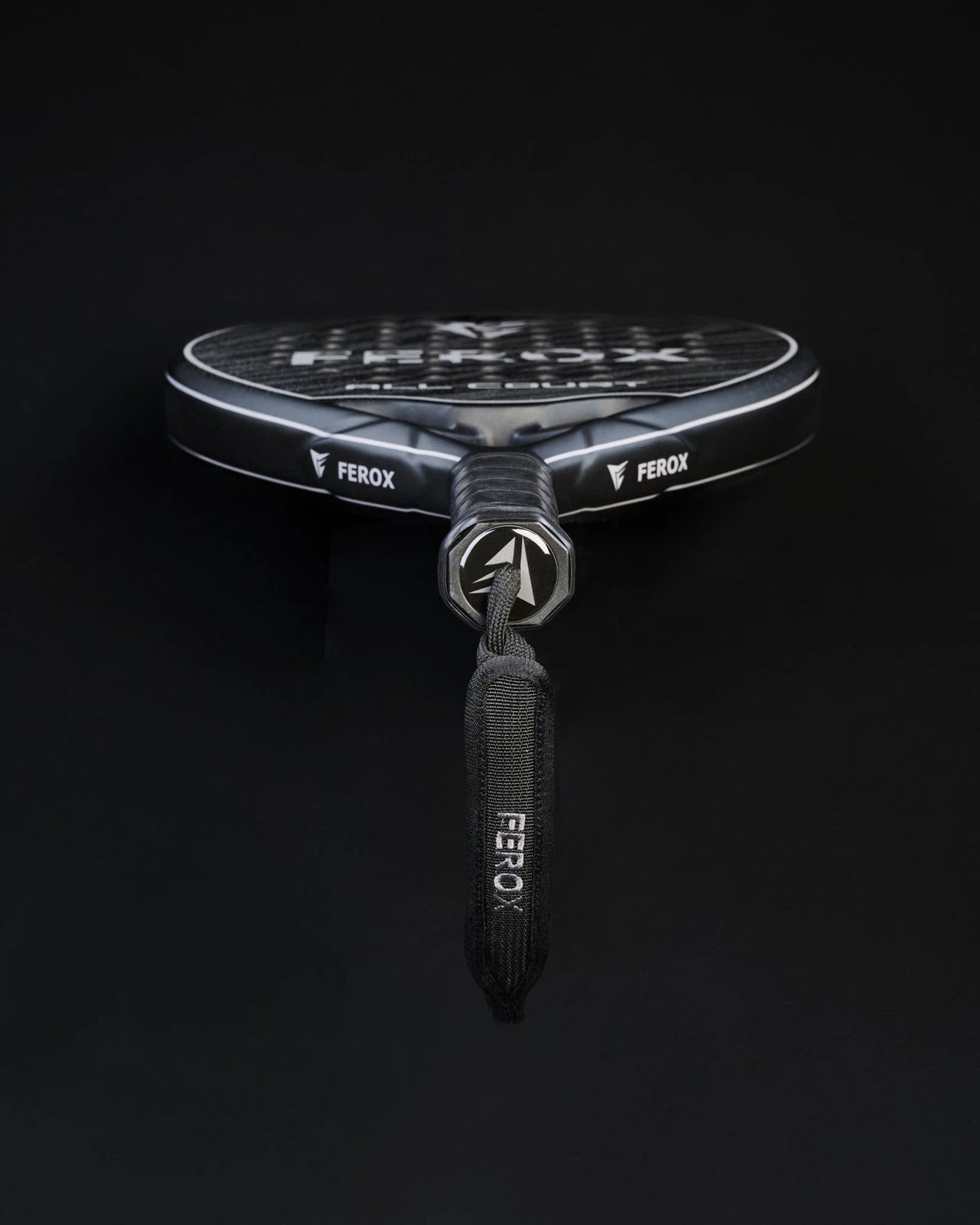 Ferox All Court 3K Padel Racket with black and red design, featuring a lightweight frame and textured hitting surface.